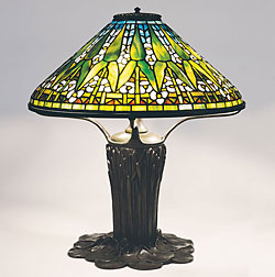 Fig. 5: Arrowhead shade, designed by Clara Driscoll circa 1904, model 1496. Diam: 20 in. Cattail Pond Lily base, designed pre-1905, model 225. The New-York Historical Society, gift of Dr. Egon Neustadt. Photography by Glenn Castellano. Clara Driscoll and the Tiffany Girls: The Women of Tiffany Studios by Margaret K. Hofer, Nina Gray, and Martin Eidelberg