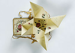 Puzzle purse with love token, American, circa 1830. Watercolor on paper inside a woven silk ribbon purse. 3-1/2 x 3-1/4 inches. Made for Love: Selections from the Jane Katcher Collection of Americana by Erin E. Eisenbarth