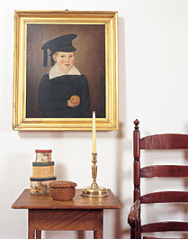 The couple's most prized piece is the charming mid-nineteenth-century portrait of a child wearing a tasseled hat and holding an orange. Though the artist's name is obscured, the attribution is to New England based on the painting being found in the attic of a Maine house. 
