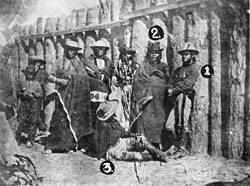 Click for Enlarged Version Fig. 7: Tintype of Tavernier sitting at the feet of Indian chiefs and military officers, taken by Lieutenant Thomas Whilhem, 1874. Courtesy of National Archives and Records Administration.