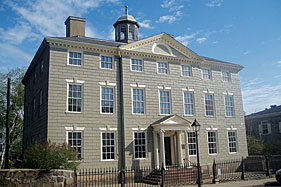 Fig. 4: Jeremiah Lee Mansion, Marblehead (Marblehead Museum & Historical Society) Colonel Jeremiah Lee, an affluent merchant, ship owner, town leader, and patriot who served in risky undercover capacities during the Revolution, built this magnificent house in 1768. Rusticated and sand-painted on all four sides to simulate stone, it was acclaimed as the Massachusetts Bay Colonys finest home in the prosperous late colonial period. It contains a notable collection of early American furniture and decorative arts, and many of the mansions original decorative finishes have been preserved, including rare eighteenth-century English hand-painted wallpaper, block-printed wallpaper, and a mahogany wainscot staircase. Copies of the full-length portraits of Jeremiah and Martha Lee by John Singleton Copley hang on either side of the stair landing.