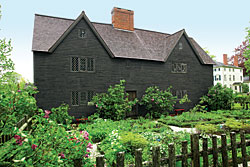 Click Here for Enlarged Version Fig. 1: Whipple House, Ipswich (Ipswich Historical Society) The Whipple House was built in stages between 1677 and circa 1730. Captain John Whipple (1625-1683) built the original house with a floor plan of two rooms over two rooms (gleaned from structural evidence and an extant will). Whipple's oldest son, Major John Whipple (1657-1722), expanded the house to its present footprint, creating a structure with three over three front formal rooms, and four over four smaller rear service rooms; it is one of the largest first period homes to survive. Additionally, the interior was meant to impress, with its exposed and chamfered beams and contrasting vermillion wooden elements against whitewashed plaster, evidence of which survives. Subsequent generations of Whipples modified the home to accommodate changes in architectural taste, and in the 1950s the gables on the exterior facade were restored based on original evidence. The Ipswich Historical Society moved the Whipple House from the center of town to its present rural location in 1927.