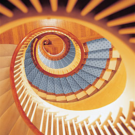"This house is a little unusual for Beacon Hill," says one of the owners. "It's wider. The typical house in Beacon Hill is maybe twenty-four feet wide and this is thirty-two." The extra width allowed Shaw to incorporate this dramatic spiral staircase into the plans.
