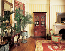 Click Here for Enlarged View The New York secretary bookcase houses a collection of Paris and Coalport porcelain with silhouette scenes of classical deities and warriors. The mahogany Restauration pier table with the Egyptian marble top is one of a pair in the double parlors that Carswell Berlin says "are as fine as anything produced in Boston of this period." The pier mirror, New York, circa 1820-1830, has been attributed to Isaac Platt (1793-1875).