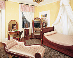Click Here for Enlarged View Except for the gracefully curved reclining couch, or récamier, most of the furniture in this room, belonging to one of the owners' daughters, is French export and came from a New Orleans auction house. The husband says this daughter showed early signs of an eye for collecting. When she was only ten or eleven, after looking at a book about Empress Josephine's house, Malmaison, she said, "I want to have a room like this.'"
