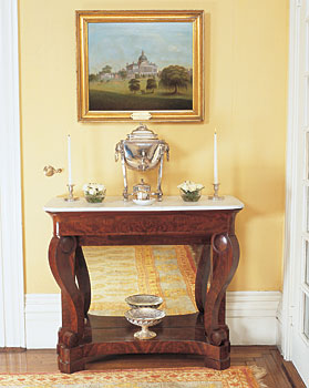 Furniture that incorporates the ancient motifs Napoleon Bonaparte (1769-1821) popularized after encountering them during his forays into Italy and Egypt is a perfect complement to Greek Revival architecture. In Europe and later in America, ancient Egyptian, Greek, and Roman motifs became prominent features of the sumptuous Empire style as seen on this Philadelphia game table, 1825-1835. Note the scaled-dolphins and lion-paw feet.
