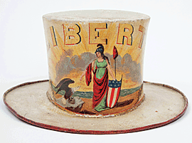 Fig. 5: Fireman’s parade hat for the Liberty Company, containing labels of hatmaker Joshua Van Sant, and painter Geo. J. Roche and Son. Baltimore, 1820–1835. Painted pressed felt. H. 6-1/2, Diam. Brim 12 in.