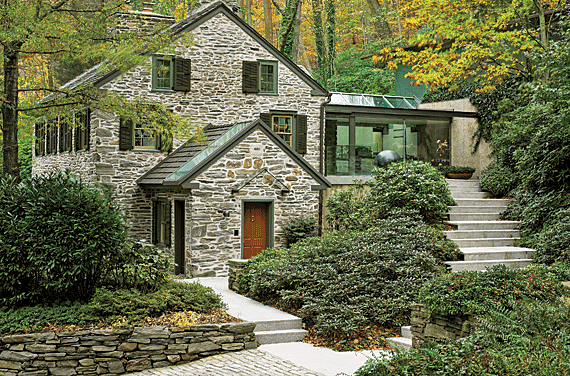 Fernside Cottage was an 1835 stone house overgrown with vines and weed trees when Dennis bought it in 1993. The living spaces are on the second floor, the kitchen, is in the glass wing behind the terrace. A guest bedroom and Dennis’ office are downstairs. In October 2008, a glass addition, hidden by the trees on the right, was finished for the master suite and Richard’s office.  