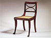 One of a Set of Six Carved<br>Mahogany Side Chairs