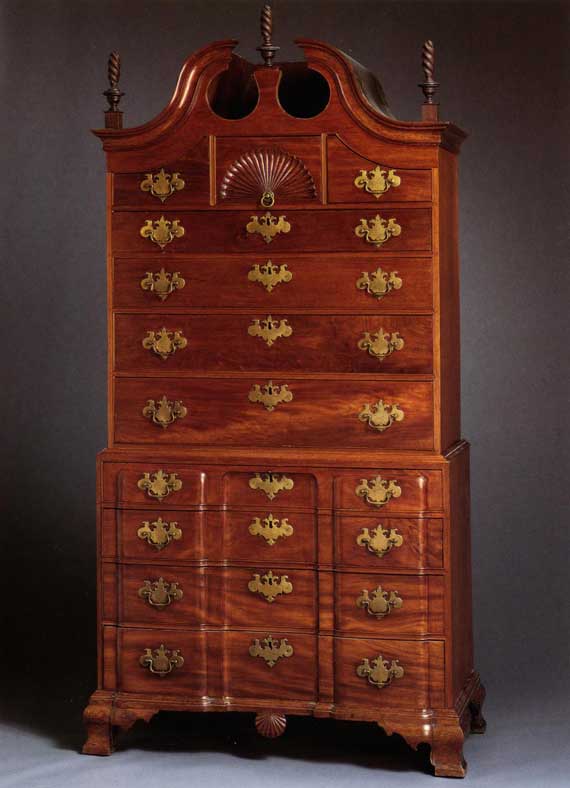 CHIPPENDALE CARVED AND FIGURED MAHOGANY BLOCK-FRONT CHEST ON CHEST